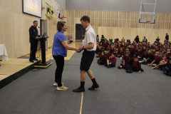 Best Overall Senior Boy, Benjamin Murray, receives his award