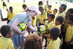 Giving out donated soccer balls