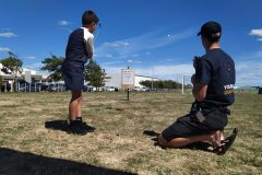 Matthew is coached on how to play golf