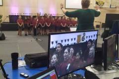 Mrs Campbell conducts the primary choir
